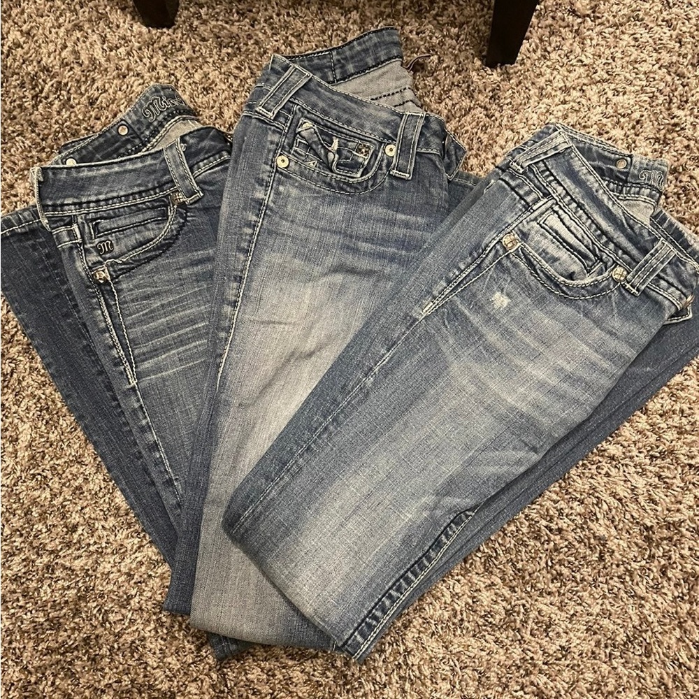 2 pairs miss me , 1 pair true religion